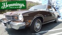 It's brown as brown can be, but it's also what's inside that makes this 1974 Mercury Comet four-door such a peach