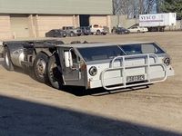 Strick's unconventional Cab-Under truck prototype, designed to skirt trucking length laws, returns to the United States, restoration underway